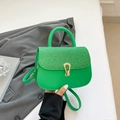 Chic vibrant green crossbody bag with glitter finish and golden horseshoe buckle - Green