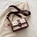 White cherry print crossbody bag with brown leather trim and cherry charm accessory - With Pendant / Brown