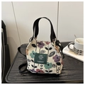 Detail of floral jacquard fabric and green leather label on the casual tote bag - Multicolor Retro Floral (Style 4)