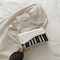 White music theme crossbody bag with piano key pattern and gold I LIKE MUSIC text - White