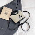 Beige woven bucket bag with black leather trim, lace edge, and silk bow detail - Black