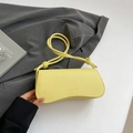Minimalist light yellow baguette bag with textured leather and knot detail handle - Yellow