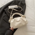 White pleated cloud dumpling bag with knotted handle and adjustable strap in PU leather - White