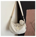 Detail of minimalist nylon crescent bag with matching round coin purse and wide strap - White