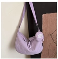 Detail of lavender nylon crescent bag with adjustable strap and matching round coin purse - Purple