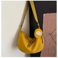 Detail of yellow crescent shoulder bag with matching round pouch and wide textile strap - Yellow