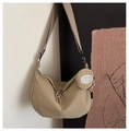 Detail of khaki crescent crossbody bag with round coin purse and textured fabric surface - Khaki