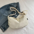 Chic beige crescent dumpling crossbody bag with adjustable strap and small round pouch - White