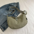 Sage green minimalist hobo bag with adjustable strap and small round charm pendant - Green