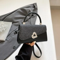 Minimalist black handbag with silver glitter flap and heart-shaped metal twist lock - Black
