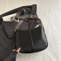 Chic black crescent underarm bag featuring a bohemian colorful floral wide strap - Black