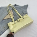 Chic baguette shoulder bag in creamy yellow with decorative buckle and slim straps - Yellow