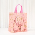 Detailed view of pink Christmas non-woven gift bag with reindeer and joy pattern - Reindeer Pattern (5054-6)