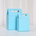Detail of light blue flip-top cardboard gift boxes in two sizes with die-cut handles - Light Blue