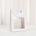 Detailed view of white paper gift bag with square window and elegant white silk bow - 16x12x7cm / White