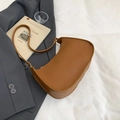 Minimalist caramel brown leather crescent shoulder bag in vintage French style - Brown