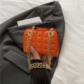Chic orange quilted shoulder bag with dual gold chain straps and a modern lattice design - Orange