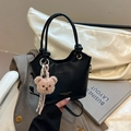 Minimalist black PU bucket bag with knot handle and plush bear charm for daily wear - Black With Pendant