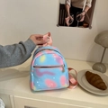 Mini backpack with blue and pink gradient star patterns and gold heart pendant - Blue