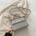 Silver glitter textured handbag with gold twist lock and crossbody strap for women - Silver