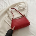 Elegant red crocodile pattern baguette bag in a glossy finish with matching shoulder strap - Red