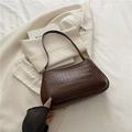 Classic dark brown baguette bag with crocodile texture and gold hardware detailing - Brown
