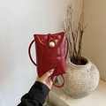 Mini red patent leather crossbody phone bag with vintage pearl accent and thin strap - Red