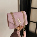 Pink sequin crossbody bag featuring a golden SS logo and metallic fringe tassels - Pink