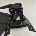 Chic black patent leather underarm bag with oversized bow and silver metal rivets - Black