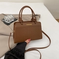Brown faux crocodile leather handbag with elegant gold hardware and top handles - Brown