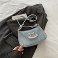 Light blue glitter underarm bag with silver metallic bow and pearl chain details - Light Blue
