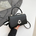 Black patchwork shoulder bag with woven texture, silver heart buckle and top handle - Black