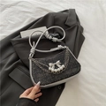 Black glitter underarm bag with silver bow, pearls and knot shoulder strap detail - Black