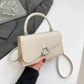 Elegant beige crossbody bag with herringbone woven flap and silver heart-shaped lock - Off White