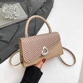 Elegant khaki tote bag with woven herringbone flap and silver heart buckle detail - Khaki