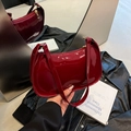 Chic red patent leather underarm bag with glossy finish and matching shoulder strap - Red