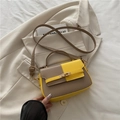 Contrast color leather saddle bag in ginger yellow and khaki with gold-tone hardware - Yellow