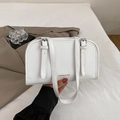 White faux leather crossbody bag with adjustable double straps and gold logo text - White