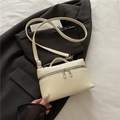 Beige litchi grain leather crossbody bag with silver zippers and adjustable strap - White