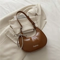 Brown semi-circle hobo bag in sleek leather with a silver beaded bow charm accessory - Brown