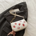 Creamy white shoulder bag with strawberry print and gold metal chain strap details - Khaki