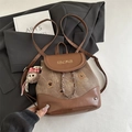 Brown leather and canvas mini backpack with embroidery and teddy bear charm accessory - Brown with Pendant