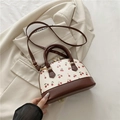 Shell shaped white handbag with red cherry print and brown contrast leather straps - Brown