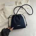 Dark blue denim bucket bag with drawstring closure and elegant pearl accents - Dark Blue