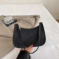 Sparkly black crescent underarm bag with shimmering metallic texture and silver zipper - Black
