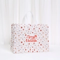 Detail of waterproof Christmas gift bag featuring red Merry Christmas text and festive icons - White Star Gingerbread Man Style (8009-2)
