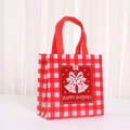 Close-up of Christmas non-woven gift bag with red plaid and Happy Holidays bells - 9050-6; 20*9*9; Brand New Nonwoven Fabric