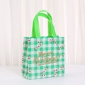 Detail of Christmas non-woven gift bag featuring green plaid and Merry Christmas text - 9050-4; 20*9*9; Brand New Nonwoven Fabric