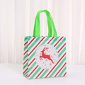 Detailed view of a Christmas non-woven gift bag with reindeer print and green handles - Red White Green Stripe Reindeer (9050-1)