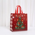 Detail of red Christmas gift bag with nutcracker print and wide carrying handles - Red Christmas Tree Nutcracker Style (5052-4)